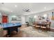 Basement featuring a ping pong table, a dining table, and a bar area at 2730 Samples Rd, Cumming, GA 30041