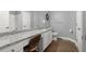 Bathroom with double vanity, granite countertop, and hardwood floors at 2730 Samples Rd, Cumming, GA 30041