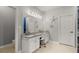 Bright bathroom featuring double sinks, granite countertops, and a separate shower room at 2730 Samples Rd, Cumming, GA 30041