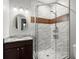 Bathroom features a sleek glass shower with a modern fixture and granite vanity at 2730 Samples Rd, Cumming, GA 30041