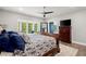 Spacious main bedroom features with a ceiling fan, neutral decor and ensuite bathroom at 2730 Samples Rd, Cumming, GA 30041