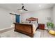Spacious main bedroom featuring a ceiling fan, ensuite bathroom with wood-look flooring and natural light at 2730 Samples Rd, Cumming, GA 30041