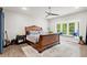 Spacious main bedroom features with a ceiling fan, window seat and neutral decor at 2730 Samples Rd, Cumming, GA 30041