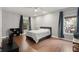 Bright bedroom featuring hardwood floors, two large windows and a neutral color scheme at 2730 Samples Rd, Cumming, GA 30041