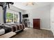 Bedroom with gray walls, a large window, and wood-look floors at 2730 Samples Rd, Cumming, GA 30041