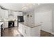 Bright kitchen with stainless steel appliances, a center island, and hardwood flooring at 2730 Samples Rd, Cumming, GA 30041