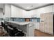 Modern kitchen with white cabinets, granite countertops, and stainless steel appliances at 2730 Samples Rd, Cumming, GA 30041
