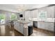 Bright kitchen with stainless steel appliances, white cabinets, and granite countertops at 2730 Samples Rd, Cumming, GA 30041