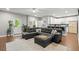 Spacious living room seamlessly connects to a modern kitchen, perfect for entertaining guests at 2730 Samples Rd, Cumming, GA 30041