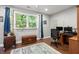 Bright office space with a large window, plants and a comfortable workspace at 2730 Samples Rd, Cumming, GA 30041