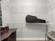 This walk-in closet boasts white wire shelving, and a dark dresser for optimized storage at 2730 Samples Rd, Cumming, GA 30041