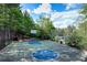 Well-maintained basketball court surrounded by mature trees and beautiful landscaping at 4742 Legacy Cove Ln, Smyrna, GA 30126