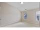 Bedroom with carpeted floor and a large window allowing plenty of natural light at 4742 Legacy Cove Ln, Smyrna, GA 30126