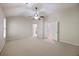 Spacious bedroom with neutral colored walls, a ceiling fan, and closet doors at 4742 Legacy Cove Ln, Smyrna, GA 30126
