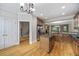 Kitchen with island, wooden cabinets, granite counters, and hardwood floors at 4742 Legacy Cove Ln, Smyrna, GA 30126