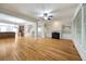 Expansive living room features hardwood floors, fireplace, and open floor plan at 4742 Legacy Cove Ln, Smyrna, GA 30126