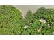 Stunning aerial view of a lakefront property with lush trees, several docks, and beautiful waterfront homes at 627 Apache Trl, Woodstock, GA 30189