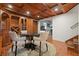 Finished basement featuring a dining area with a wooden ceiling, tile floors, and a unique layout at 627 Apache Trl, Woodstock, GA 30189