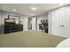 Well-lit bedroom features a closet, desk, dresser, and a television set at 627 Apache Trl, Woodstock, GA 30189