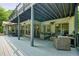Large outdoor deck features wicker furniture, ceiling and patio heater at 627 Apache Trl, Woodstock, GA 30189