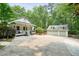 Charming home with a spacious driveway and a detached two-car garage at 627 Apache Trl, Woodstock, GA 30189