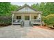 Inviting front porch with comfortable seating, perfect for relaxing outdoors at 627 Apache Trl, Woodstock, GA 30189