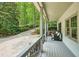 Spacious front porch offering scenic views and comfortable outdoor seating at 627 Apache Trl, Woodstock, GA 30189