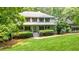Inviting two-story home with a well-maintained front yard, classic shutters, and a welcoming front porch at 627 Apache Trl, Woodstock, GA 30189