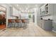 Modern kitchen featuring white cabinets, granite countertops, stainless steel appliances, and ample counter space at 627 Apache Trl, Woodstock, GA 30189