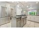 Gourmet kitchen with stainless appliances, granite countertops, and a spacious center island at 627 Apache Trl, Woodstock, GA 30189