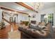 Elegant living room featuring a decorative chandelier, hardwood floors, and a cozy seating arrangement at 627 Apache Trl, Woodstock, GA 30189