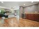 Spacious main bedroom with hardwood floors, a bar, and access to a private balcony at 627 Apache Trl, Woodstock, GA 30189