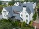 Beautiful aerial view of white townhouse and gray roofs showcasing the manicured landscaping and elegant architectural details at 201 Dovecrest Dr, Atlanta, GA 30305
