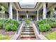 Elegant backyard with manicured landscaping and covered patio area at 201 Dovecrest Dr, Atlanta, GA 30305
