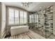 Luxurious bathroom featuring soaking tub, glass shower, and modern design at 201 Dovecrest Dr, Atlanta, GA 30305