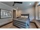 Stylish bedroom with unique decor, a plush bed, and hardwood floors for a comfortable retreat at 201 Dovecrest Dr, Atlanta, GA 30305
