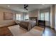 Comfortable bedroom with a plush bed, soft carpet, and stylish decor, bathed in natural light at 201 Dovecrest Dr, Atlanta, GA 30305