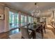 Dining room with access to outdoor patio through french doors and views into kitchen at 201 Dovecrest Dr, Atlanta, GA 30305