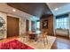 Spacious dining room featuring hardwood floors and a modern wood paneled accent wall at 201 Dovecrest Dr, Atlanta, GA 30305