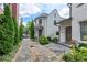Beautiful home exterior featuring a brick pathway leading to a welcoming entrance of this charming townhome at 201 Dovecrest Dr, Atlanta, GA 30305