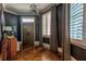 Elegant foyer featuring herringbone floors, stylish lighting, and a solid wood front door at 201 Dovecrest Dr, Atlanta, GA 30305
