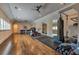 Expansive home gym with hardwood floors, multiple windows, and a variety of exercise equipment at 201 Dovecrest Dr, Atlanta, GA 30305