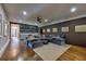 Open concept living area with a large sectional couch and built in wet bar at 201 Dovecrest Dr, Atlanta, GA 30305