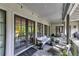 Relaxing outdoor covered patio with comfortable seating area at 201 Dovecrest Dr, Atlanta, GA 30305