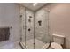 Modern glass shower with marble tile surround, rain shower head, and built-in niche at 201 Dovecrest Dr, Atlanta, GA 30305