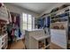 Spacious walk-in closet with custom shelving, drawers, and a central island for ample storage at 201 Dovecrest Dr, Atlanta, GA 30305