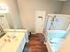 Bathroom featuring double vanity, shower, and separate soaking tub at 2077 Appaloosa Way Way, Conyers, GA 30012