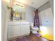 Bright bathroom with white vanity, modern fixtures and decorative floral accents at 2077 Appaloosa Way Way, Conyers, GA 30012
