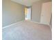Empty bedroom features neutral walls and flooring, offering a blank canvas at 2077 Appaloosa Way Way, Conyers, GA 30012
