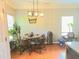 Charming dining area with hardwood floors, modern lighting, and ample natural light at 2077 Appaloosa Way Way, Conyers, GA 30012